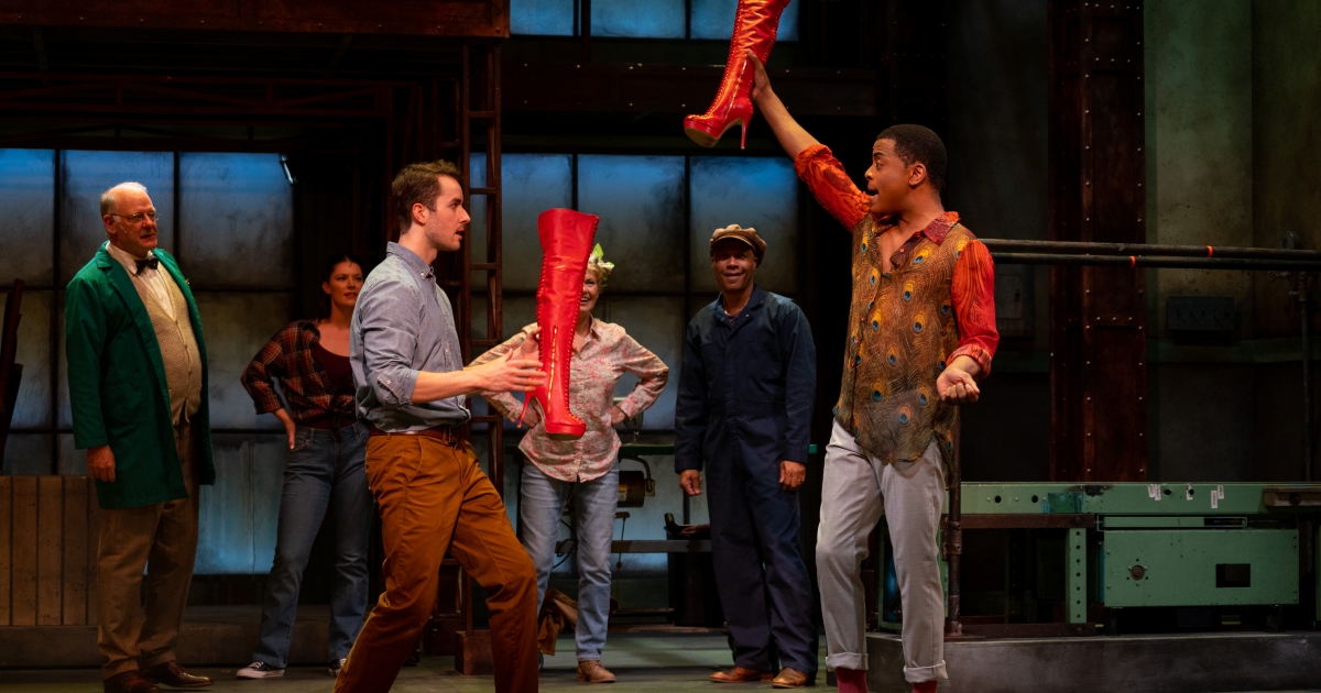 Photo by Moonrider Productions. Cast of Kinky Boots, 2022: set design by Pam Johnson; costume design by Barbara Clayden; lighting design by John Webber.